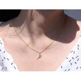Pendentif or jaune 18 carats "raquette de tennis"